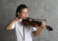 Pretty girl playing violin Royalty Free Stock Photo