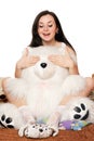 Pretty girl plays with a teddy bear Royalty Free Stock Photo