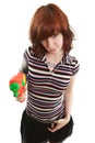 Pretty girl pointing squirt gun Royalty Free Stock Photo