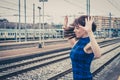 Pretty girl posing along the tracks