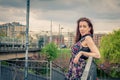 Pretty girl posing on railroad bridge