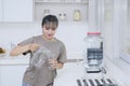 Pretty girl pouring fresh water at home Royalty Free Stock Photo