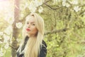 Pretty girl with red lips and blonde hair in blossom Royalty Free Stock Photo