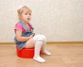 Pretty girl and red potty