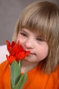 Pretty Girl with Red Tulips Royalty Free Stock Photo