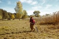 Pretty girl riding bicycle in field