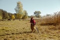 Pretty girl riding bicycle in field