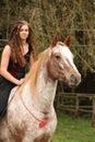 Pretty girl riding a horse without any equipment Royalty Free Stock Photo