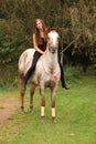 Pretty girl riding a horse without any equipment Royalty Free Stock Photo