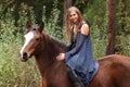 Pretty girl riding a horse without any equipment Royalty Free Stock Photo