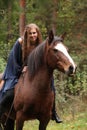 Pretty girl riding a horse without any equipment Royalty Free Stock Photo