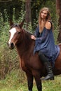 Pretty girl riding a horse without any equipment Royalty Free Stock Photo