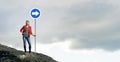 Pretty girl with roadsign Royalty Free Stock Photo