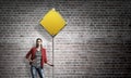 Pretty girl with roadsign Royalty Free Stock Photo