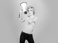 Pretty girl shouting into megaphone isolated, copy space. Idea for marketing or sales banner.