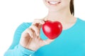 Pretty girl showing red heart Royalty Free Stock Photo