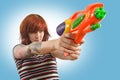 Pretty girl with squirt gun Royalty Free Stock Photo