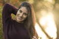 Pretty girl with straight hair in nature smiling happy and carefree