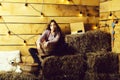 Pretty girl on straw bales Royalty Free Stock Photo