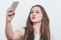 Pretty girl taking selfie on cell phone camera Royalty Free Stock Photo