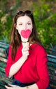 Pretty girl is taking a selfie with a lollipop. Royalty Free Stock Photo