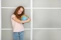 pretty girl tenderly hugs the globe Royalty Free Stock Photo