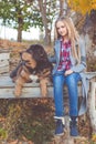 Pretty girl with tibetan mastiff on the nature Royalty Free Stock Photo