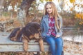 Pretty girl with tibetan mastiff on the nature Royalty Free Stock Photo