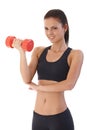 Pretty girl training with dumbbell smiling