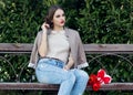 Pretty girl with tulips sitting on the bench Royalty Free Stock Photo