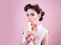 Pretty girl in vintage style. pinup girl with fashion hair. banana dieting. pin up woman with trendy makeup. retro woman Royalty Free Stock Photo