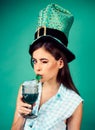 Pretty girl in vintage style. pinup girl with fashion hair. retro woman drink summer cocktail. St. Patricks Day pin up Royalty Free Stock Photo