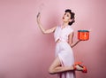 Pretty girl in vintage style. retro woman cooking in kitchen. pin up woman with trendy makeup. pinup girl with fashion Royalty Free Stock Photo