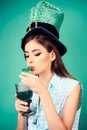 Pretty girl in vintage style. retro woman drink summer cocktail. St. Patricks Day pin up woman with trendy makeup. pinup Royalty Free Stock Photo