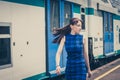 Pretty girl walking along the tracks Royalty Free Stock Photo