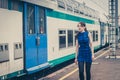 Pretty girl walking along the tracks Royalty Free Stock Photo