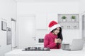 Pretty girl with laptop and Santa hat Royalty Free Stock Photo