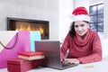 Pretty girl using a laptop for shopping online Royalty Free Stock Photo