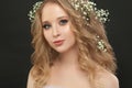 Pretty girl with white flowers on black, beautiful face closeup Royalty Free Stock Photo