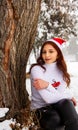 Pretty girl in winter forest, young woman in winter park Royalty Free Stock Photo