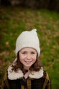 Pretty girl with wool hat in a park Royalty Free Stock Photo