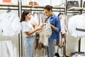 Pretty girls choosing clothes in clothing store Royalty Free Stock Photo