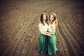 Pretty girls outdoor walking and embrancing in the field Royalty Free Stock Photo