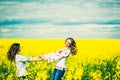 Pretty girls outdoor walking in the field in embroidery shirts Royalty Free Stock Photo