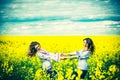 Pretty girls outdoor walking in the field in embroidery shirts Royalty Free Stock Photo