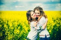 Pretty girls outdoor walking in the field in embroidery shirts Royalty Free Stock Photo