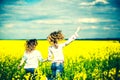 Pretty girls outdoor walking in the field in embroidery shirts Royalty Free Stock Photo