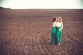 Pretty girls outdoor walking in the field, holding hands Royalty Free Stock Photo