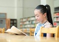 Pretty girls studying in the library