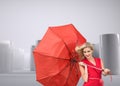 Pretty glamour woman holding a broken umbrella